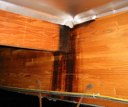 Black streaks showing roof condensation damage