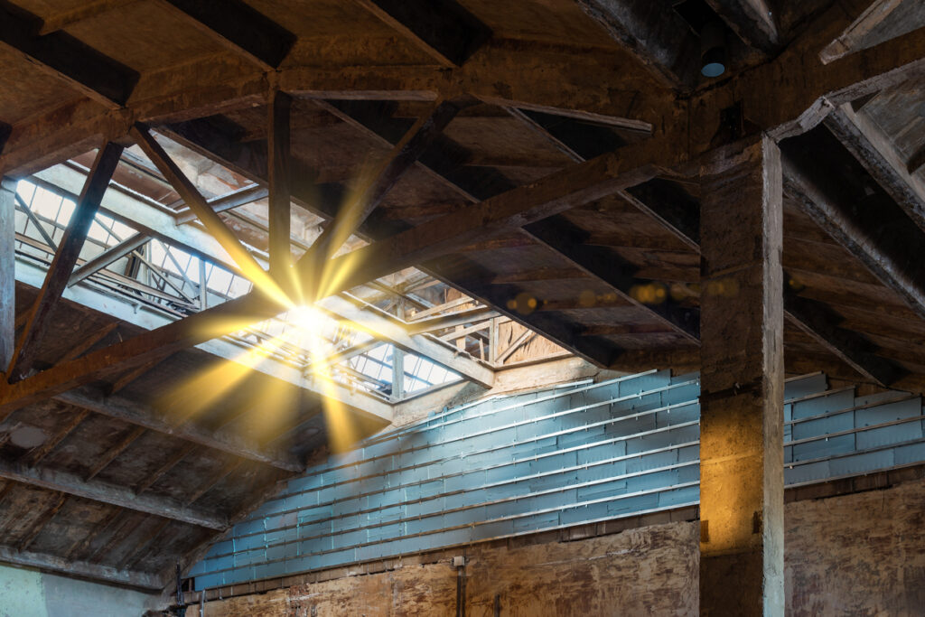 Sun rays coming through an industrial roof structure