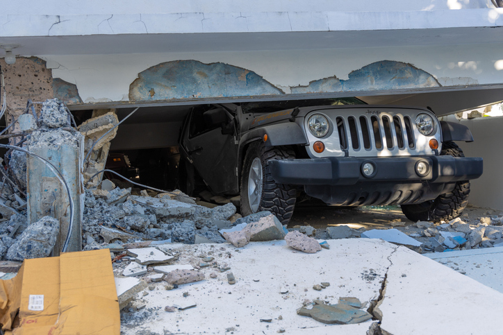 Soft-story building collapse crushes car